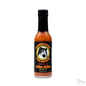 Flaske med Piko Riko hot sauce fra Piko Peppers – en piri piri-inspirert saus med Habanero og Cayenne.