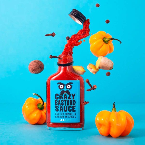 Crazy Bastard Scotch Bonnet & Caribbean Spices hot sauce 100 ml glassflaske med blå etikett