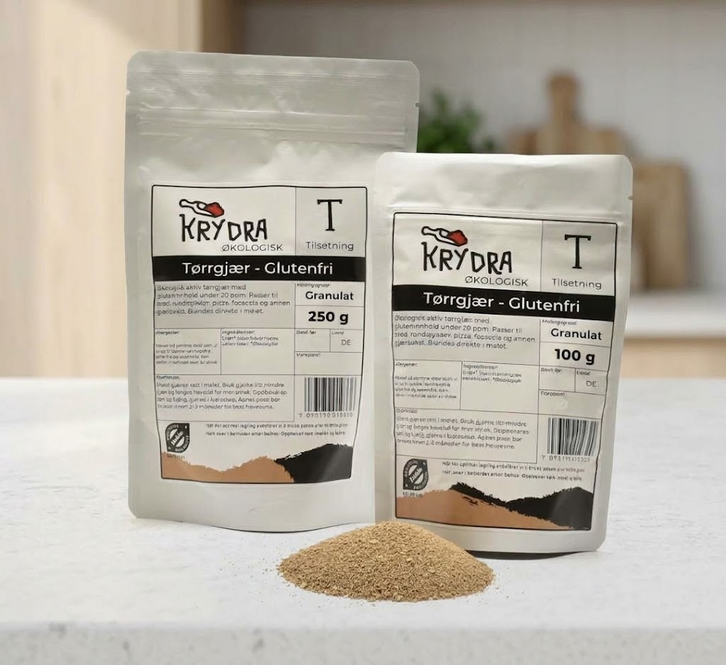 Glutenfri økologisk tørrgjær fra Krydra i 250 g og 100 g pose, med en liten haug tørrgjær foran